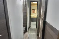 Hallway inside 2014 Nautitech 40 Open yacht, featuring modern wood paneling and sleek design.