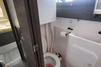 Bathroom interior of 2014 Nautitech 40 Open yacht, featuring modern fixtures and compact design.