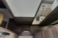 Interior of 2014 Nautitech 40 Open yacht, featuring a compact bathroom and cozy cabin space.