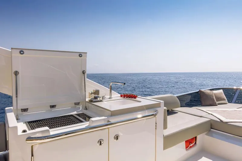 Absolute 47 Fly Yacht Photos Pics Luxury yacht Absolute 47 Fly 2025 with outdoor kitchen and ocean view.