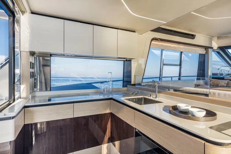 Absolute 47 Fly Yacht Photos Pics Luxurious kitchen interior of 2025 Absolute 47 Fly yacht with ocean view.