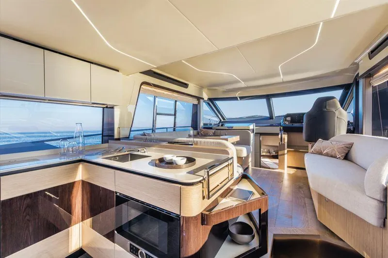 Absolute 47 Fly Yacht Photos Pics Luxurious interior of 2025 Absolute 47 Fly yacht with modern kitchen and seating area.