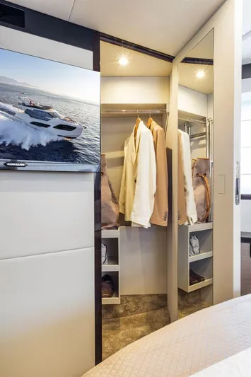 Absolute 47 Fly Yacht Photos Pics Luxurious closet interior on 2025 Absolute 47 Fly yacht with elegant clothing and modern design.