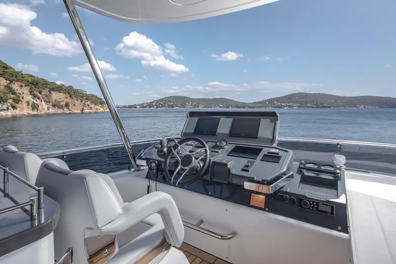  Yacht Photos Pics Helm of 2026 Sirena 60 yacht with scenic ocean view and modern controls.