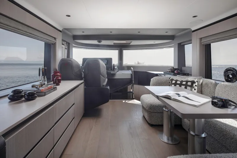  Yacht Photos Pics Luxurious interior of 2026 Sirena 60 yacht with modern furnishings and ocean view.