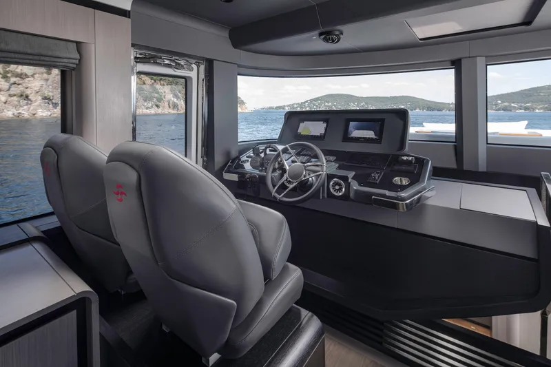  Yacht Photos Pics Helm of 2026 Sirena 60 yacht with modern controls and panoramic view.
