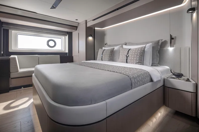  Yacht Photos Pics Luxurious bedroom interior of 2026 Sirena 60 yacht with modern design and elegant furnishings.