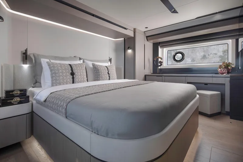  Yacht Photos Pics Luxurious bedroom interior of 2026 Sirena 60 yacht with modern design and elegant decor.