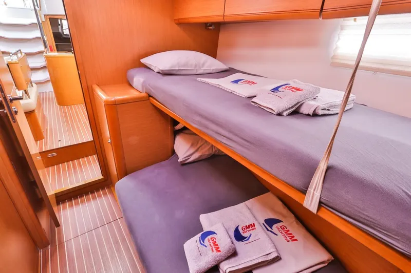 Amelie Yacht Photos Pics Cozy cabin with bunk beds in a 2011 Jeanneau 57 yacht.