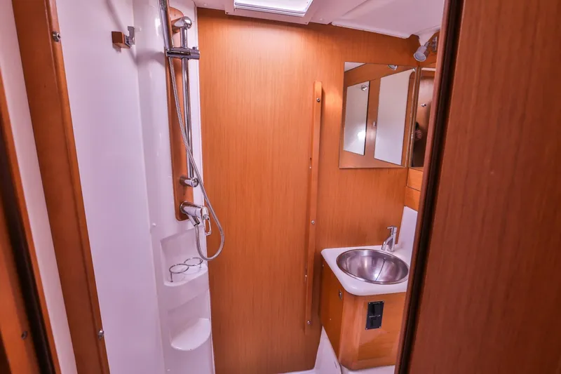 Amelie Yacht Photos Pics Bathroom interior of 2011 Jeanneau 57 yacht with shower and sink.