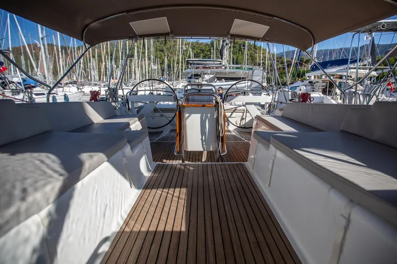 Amelie Yacht Photos Pics 2011 Jeanneau 57 yacht cockpit with dual steering wheels and teak flooring.