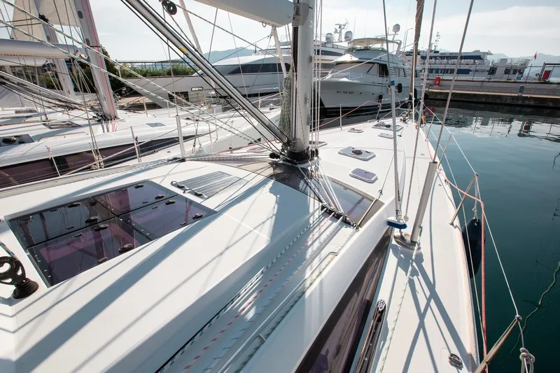 Amelie Yacht Photos Pics Jeanneau 57 sailboat, 2011 model, docked in a marina with clear skies.