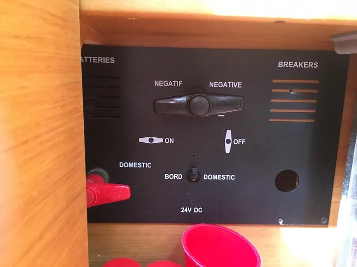Amelie Yacht Photos Pics Electrical panel on a 2011 Jeanneau 57 yacht, showing battery and breaker switches.