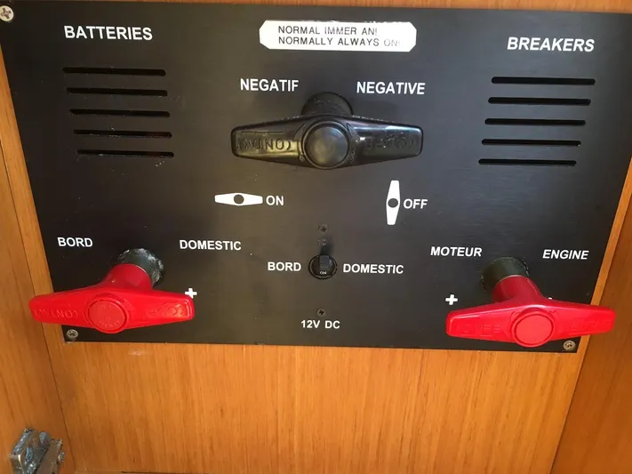 Amelie Yacht Photos Pics Control panel of a 2011 Jeanneau 57 yacht, featuring battery and breaker switches.