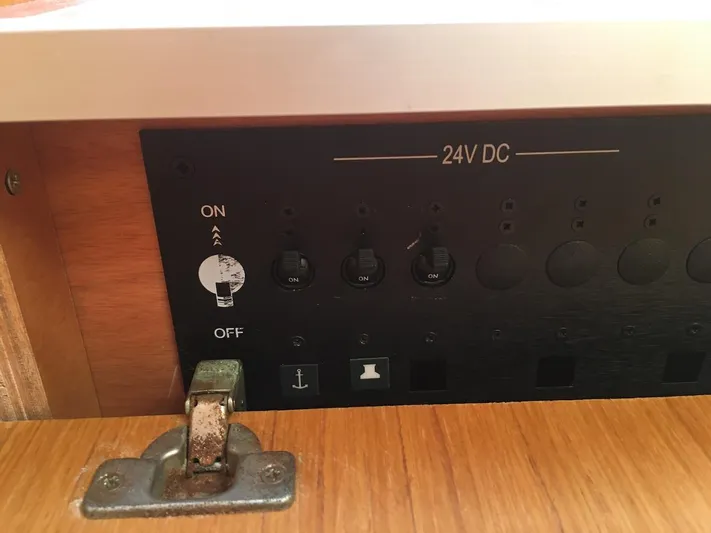 Amelie Yacht Photos Pics Control panel of a 2011 Jeanneau 57 yacht, featuring 24V DC switches.