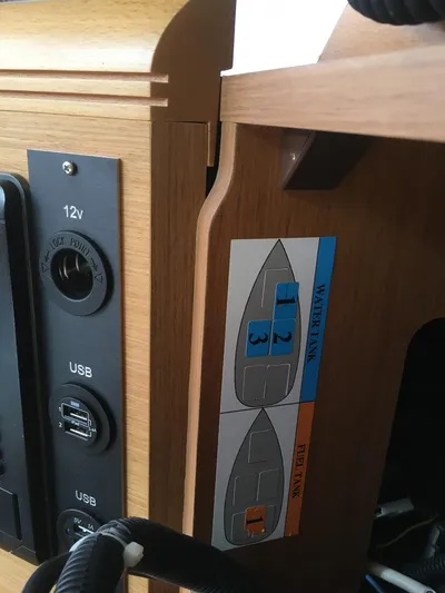 Amelie Yacht Photos Pics Control panel on a 2011 Jeanneau 57 yacht with USB and 12V outlets.