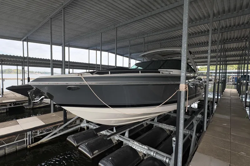  Yacht Photos Pics 2021 Formula 330 Crossover Bowrider I/O docked in a covered marina.