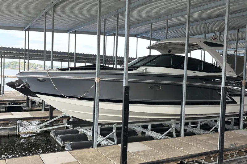  Yacht Photos Pics 2021 Formula 330 Crossover Bowrider I/O docked in a covered marina.
