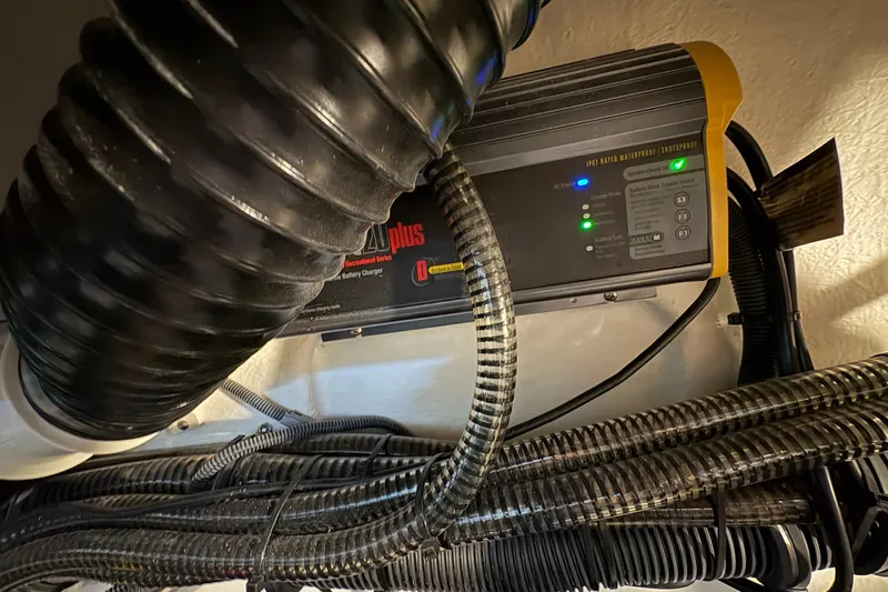  Yacht Photos Pics Battery charger in a 2021 Formula 330 Crossover Bowrider I/O boat engine compartment.