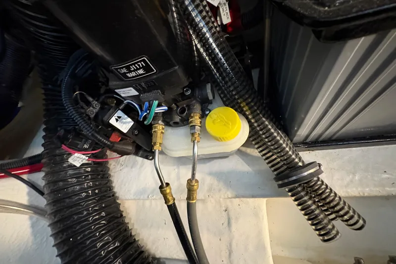  Yacht Photos Pics Engine compartment of a 2021 Formula 330 Crossover Bowrider I/O with hoses and wiring.