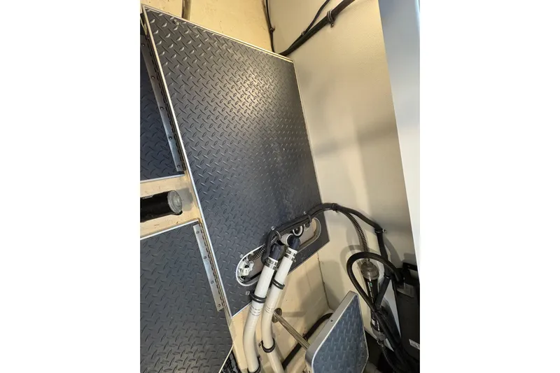  Yacht Photos Pics Engine compartment of 2021 Formula 330 Crossover Bowrider I/O with diamond plate flooring.