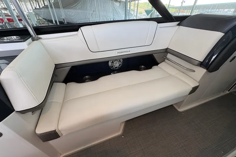  Yacht Photos Pics 2021 Formula 330 Crossover Bowrider I/O interior seating with white upholstery and cup holders.