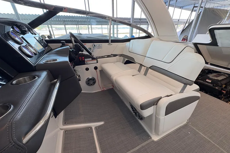  Yacht Photos Pics 2021 Formula 330 Crossover Bowrider I/O interior with sleek dashboard and comfortable seating.