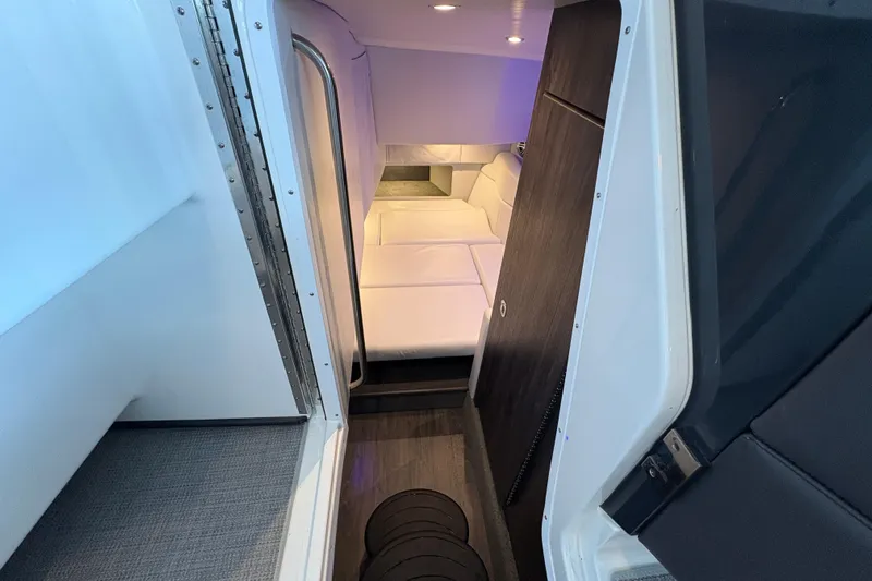  Yacht Photos Pics 2021 Formula 330 Crossover Bowrider I/O cabin interior with modern seating and lighting.