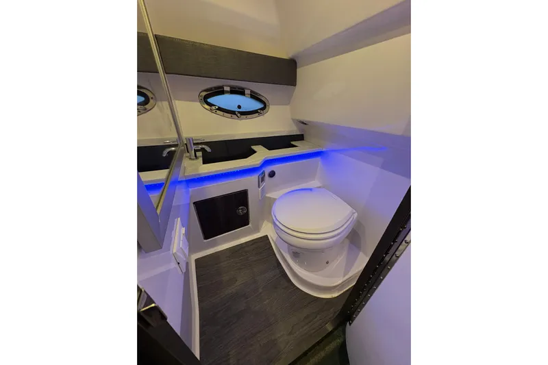  Yacht Photos Pics 2021 Formula 330 Crossover Bowrider I/O bathroom with modern design and blue LED lighting.