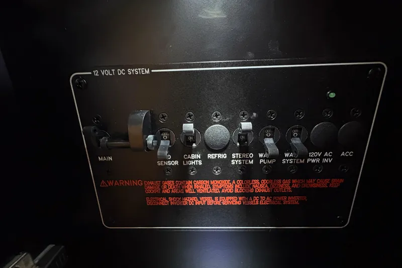  Yacht Photos Pics Control panel of 2021 Formula 330 Crossover Bowrider I/O, featuring 12V DC system switches.