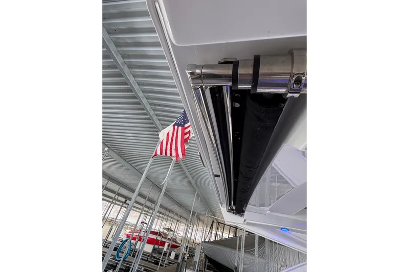  Yacht Photos Pics 2021 Formula 330 Crossover Bowrider I/O with American flag in marina setting.