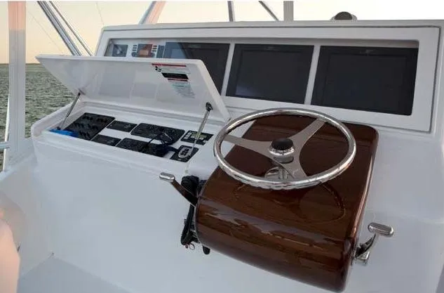 Yacht Photos Pics Manufacturer Provided Image: 2013 Hatteras GT54 helm station with steering wheel and navigation screens.
