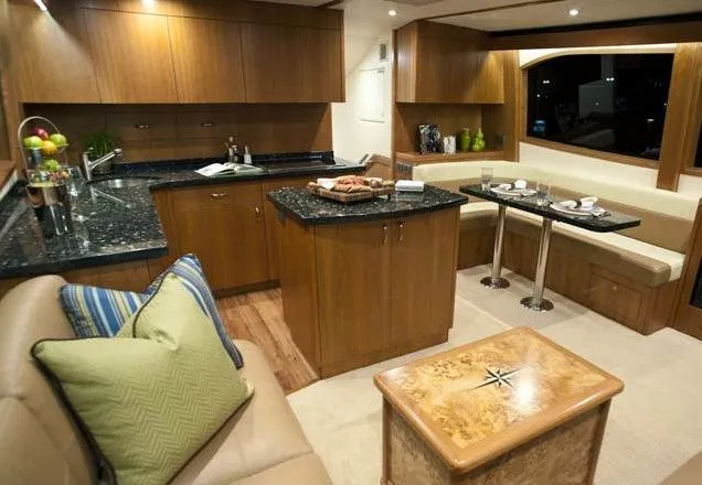  Yacht Photos Pics Manufacturer Provided Image: Luxurious interior of 2013 Hatteras GT54 yacht with modern kitchen and dining area.