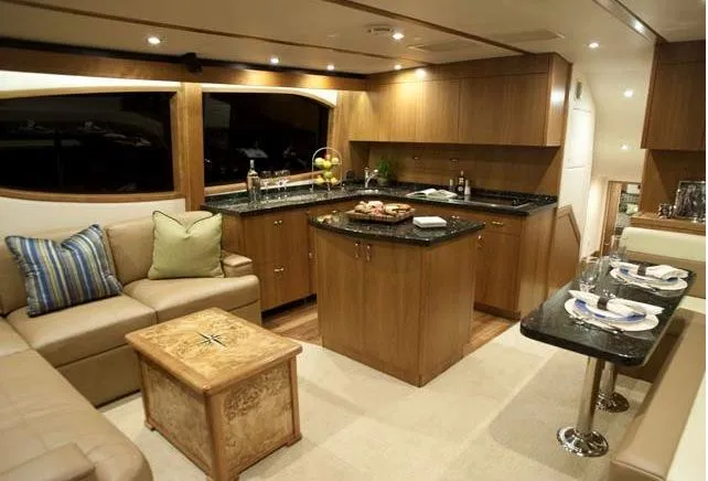 Yacht Photos Pics Manufacturer Provided Image: Luxurious interior of 2013 Hatteras GT54 yacht with modern kitchen and cozy seating area.