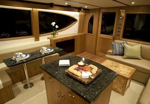  Yacht Photos Pics Manufacturer Provided Image: Luxurious interior of 2013 Hatteras GT54 yacht with modern kitchen and dining area.