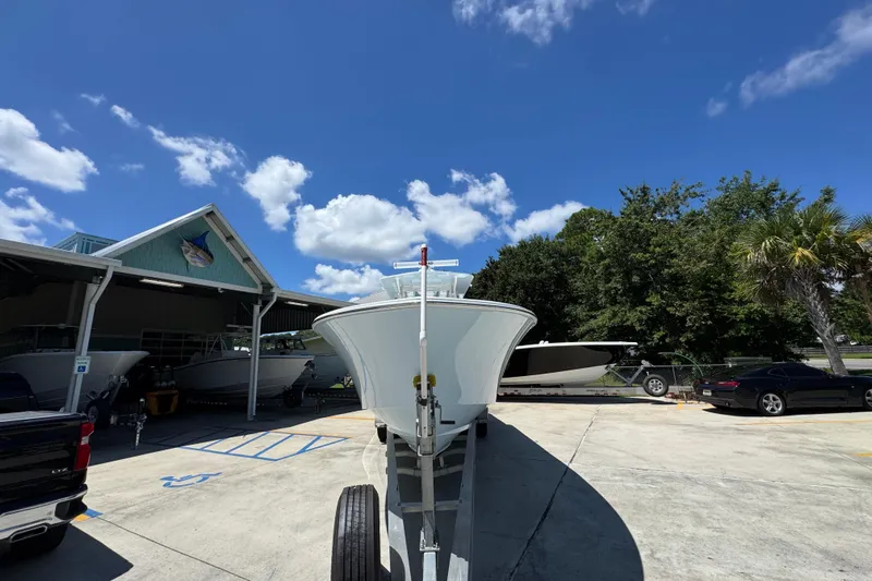  Yacht Photos Pics 2021 Invincible 36 Open Fisherman boat on trailer under clear blue sky.