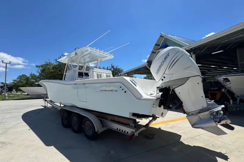 Yacht Photos Pics 2021 Invincible 36 Open Fisherman boat with Mercury engine on trailer.