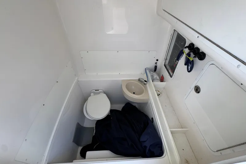 Yacht Photos Pics 2021 Invincible 36 Open Fisherman boat interior with toilet and sink.