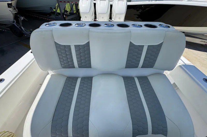  Yacht Photos Pics 2021 Invincible 36 Open Fisherman boat seat with gray and white upholstery.