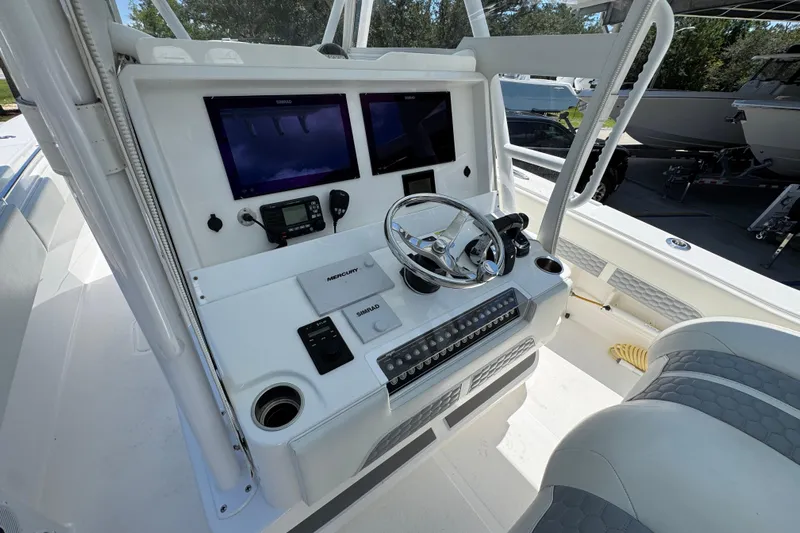  Yacht Photos Pics 2021 Invincible 36 Open Fisherman boat console with dual screens and steering wheel.
