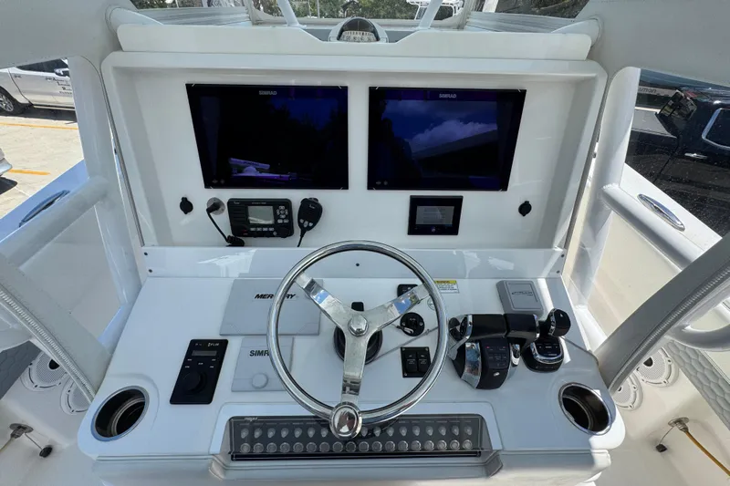  Yacht Photos Pics 2021 Invincible 36 Open Fisherman helm with dual Simrad displays and Mercury controls.