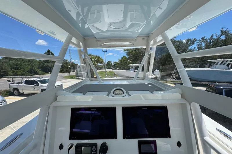 Yacht Photos Pics 2021 Invincible 36 Open Fisherman boat cockpit with dual screens and clear canopy.