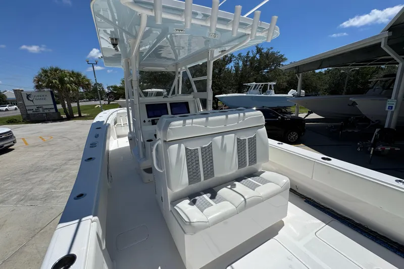  Yacht Photos Pics 2021 Invincible 36 Open Fisherman boat with seating and console, parked outdoors under clear sky.