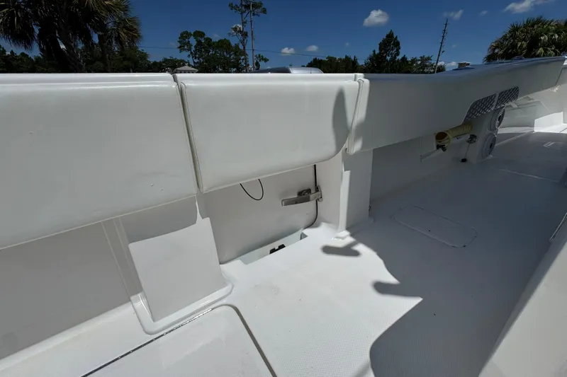  Yacht Photos Pics 2021 Invincible 36 Open Fisherman boat interior with white seating and storage compartments.