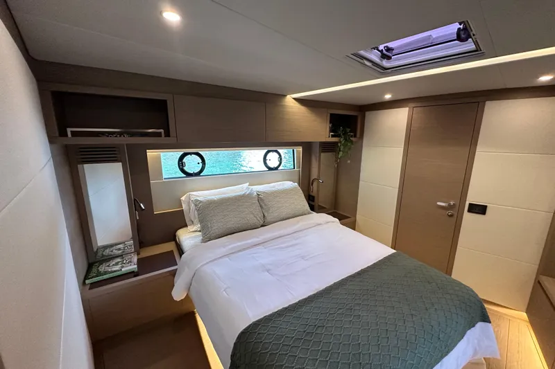  Yacht Photos Pics Luxurious bedroom interior of 2026 Pardo Yachts GT52 with modern design and cozy bedding.