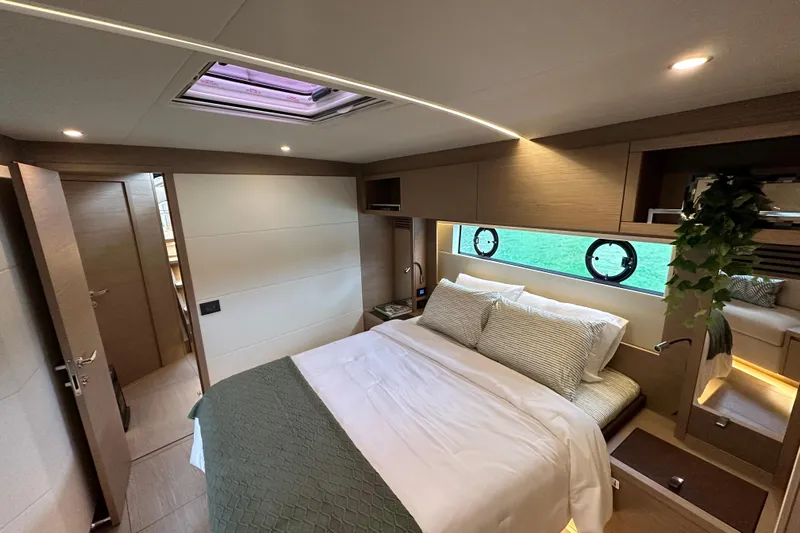  Yacht Photos Pics Luxurious bedroom interior of 2026 Pardo Yachts GT52, featuring elegant design and natural lighting.