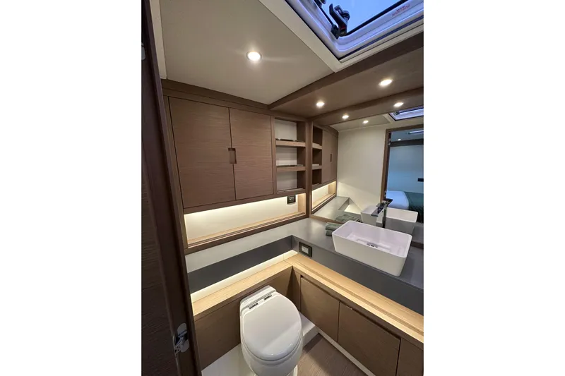  Yacht Photos Pics Luxurious bathroom interior of 2026 Pardo Yachts GT52 with modern fixtures and wood accents.