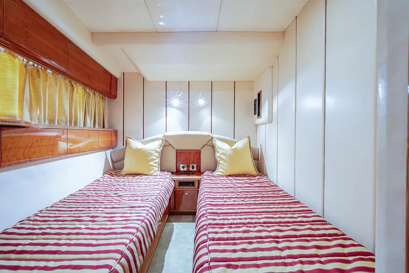 October Princess Yacht Photos Pics Twin cabin with striped bedding in 2000 Viking Sport Cruisers 72 yacht.