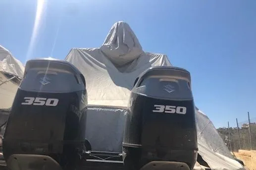  Yacht Photos Pics Covered 2009 Scout 350 Abaco boat with twin 350 engines under a clear blue sky.