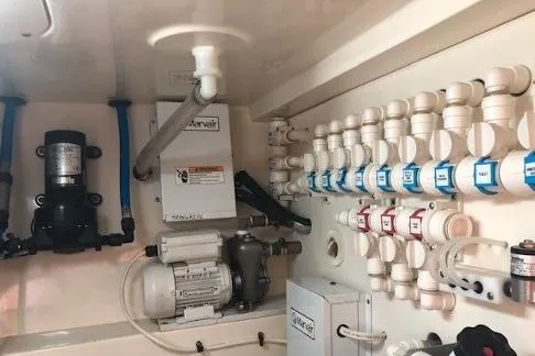  Yacht Photos Pics Engine room of a 2009 Scout 350 Abaco boat, showcasing mechanical components and wiring.